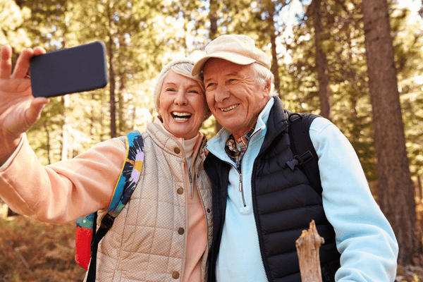 senior couple taking selfie technology trends